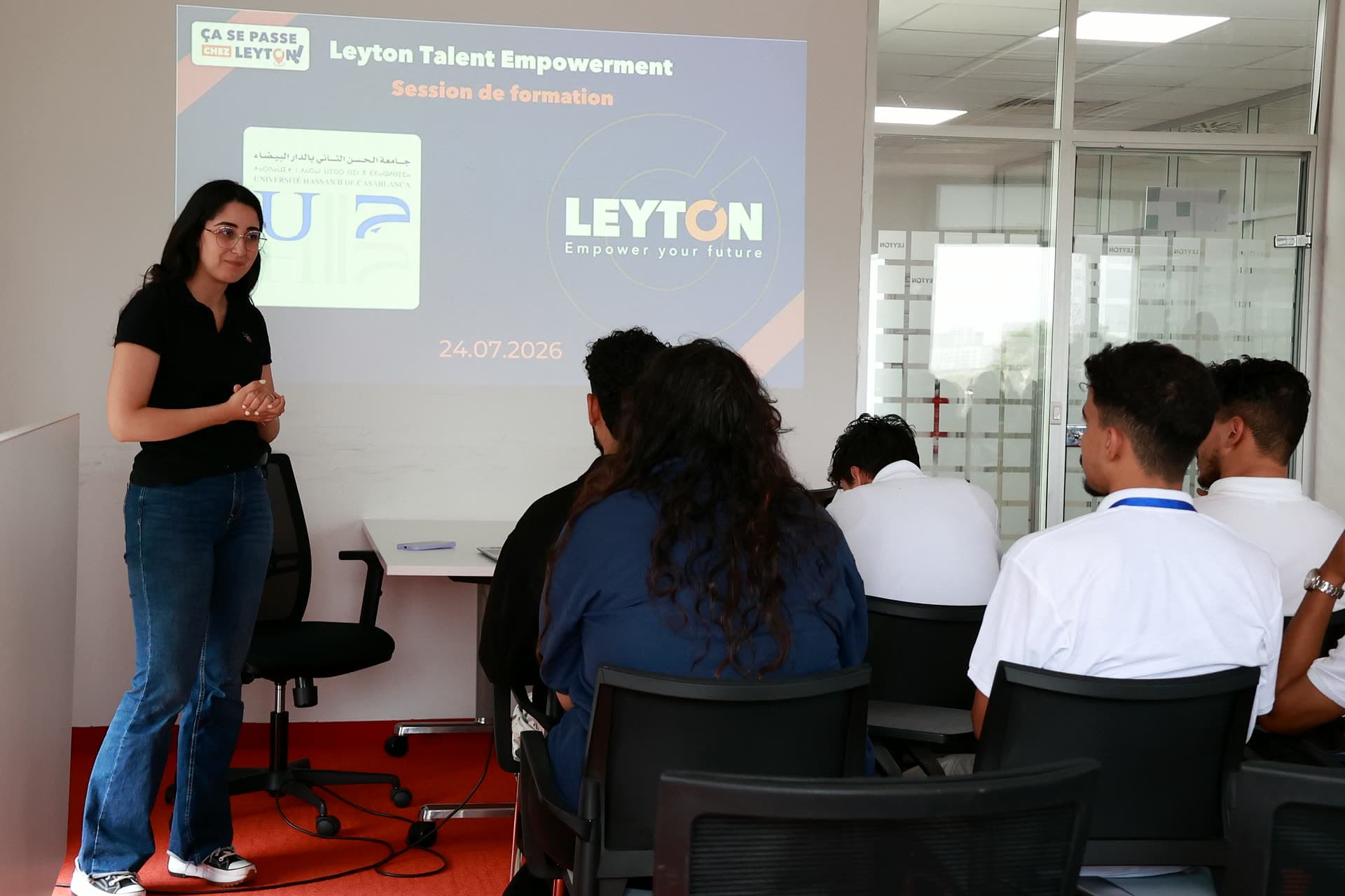 Facilitator presenting the Leyton talent-empowerment session to seated participants.
