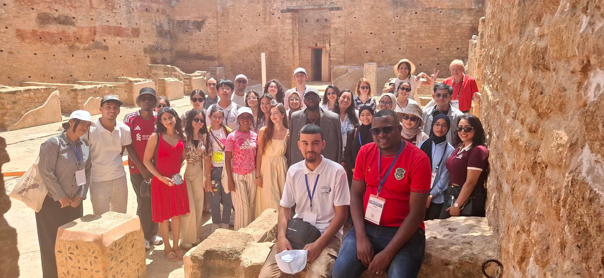 The group gathered among the ancient ruins of Chellah.