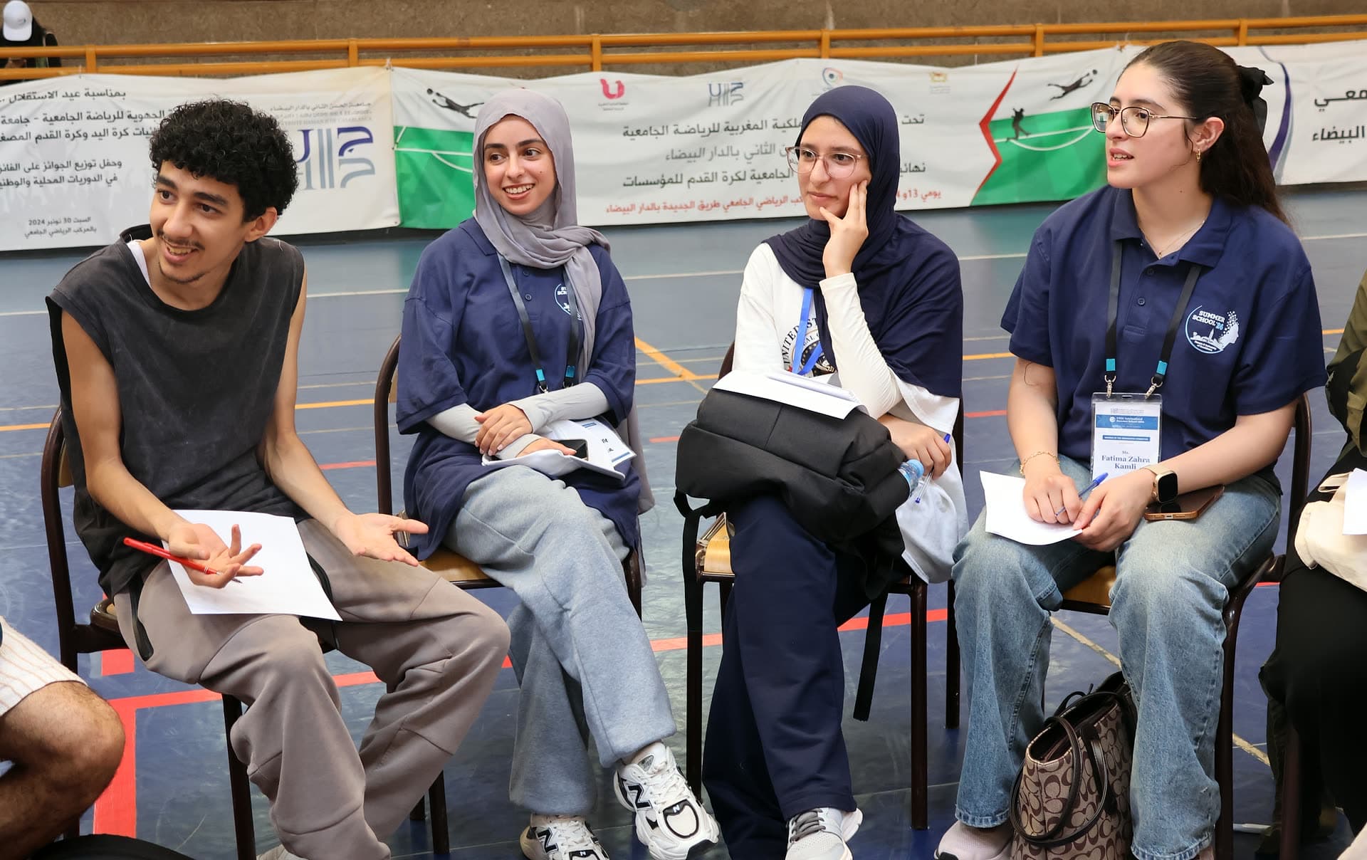 Four participants laughing together during the creators-meetup circle.