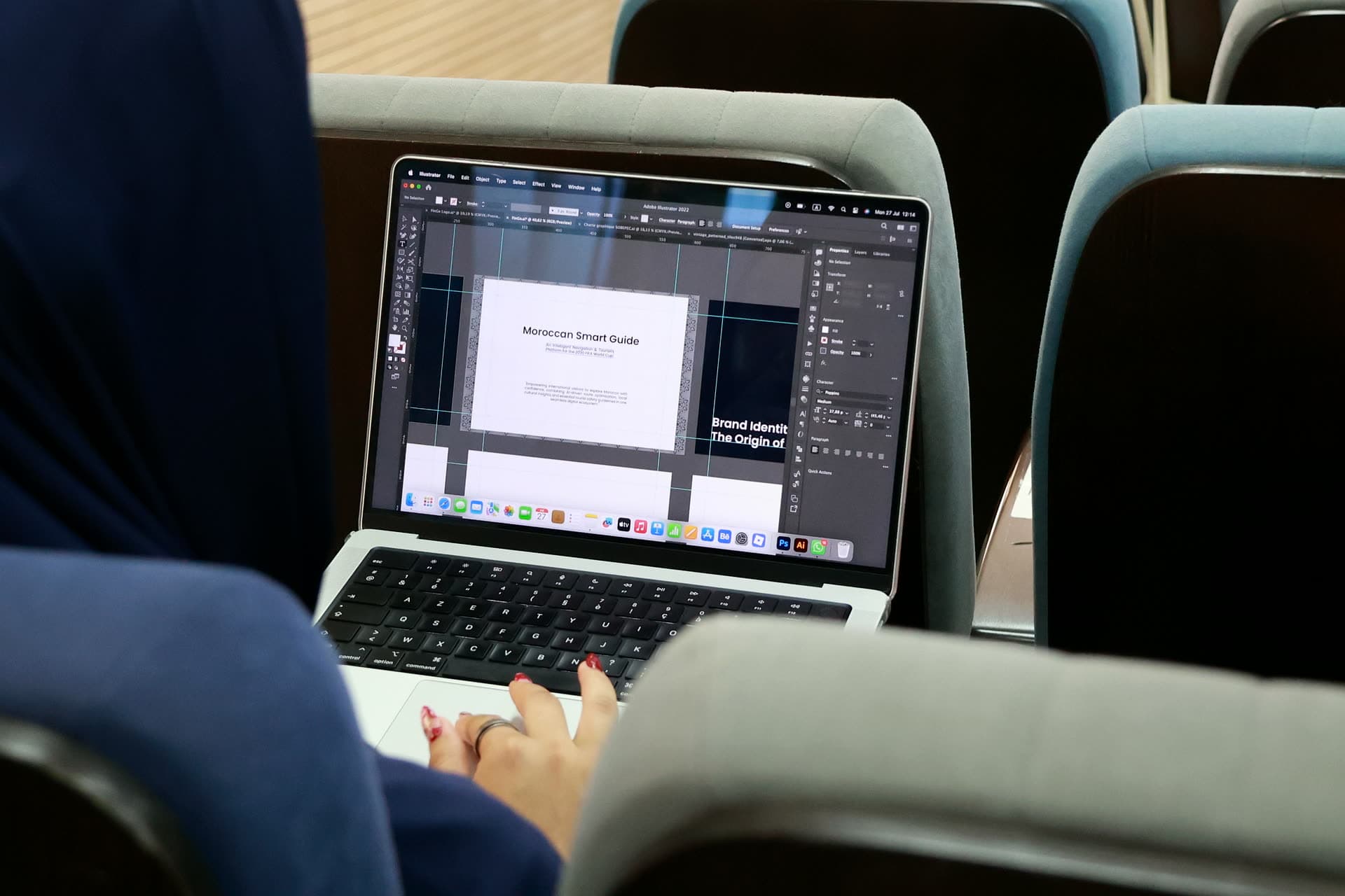 Close-up of a participant’s laptop showing a design tool with a “Moroccan Smart Guide” brand project.