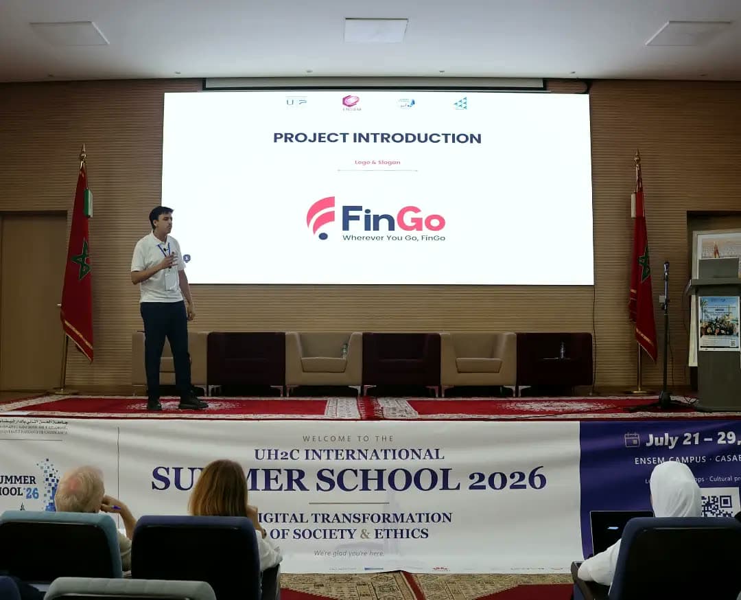 Participant opening the FinGo project introduction on stage.