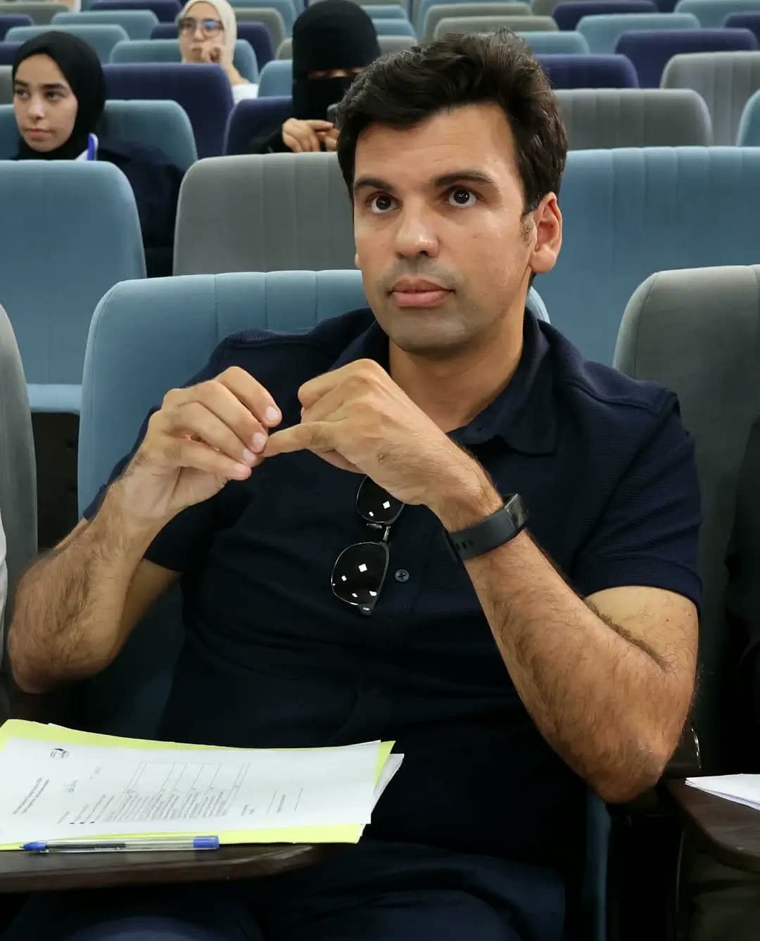 Jury member weighing an idea mid-presentation.