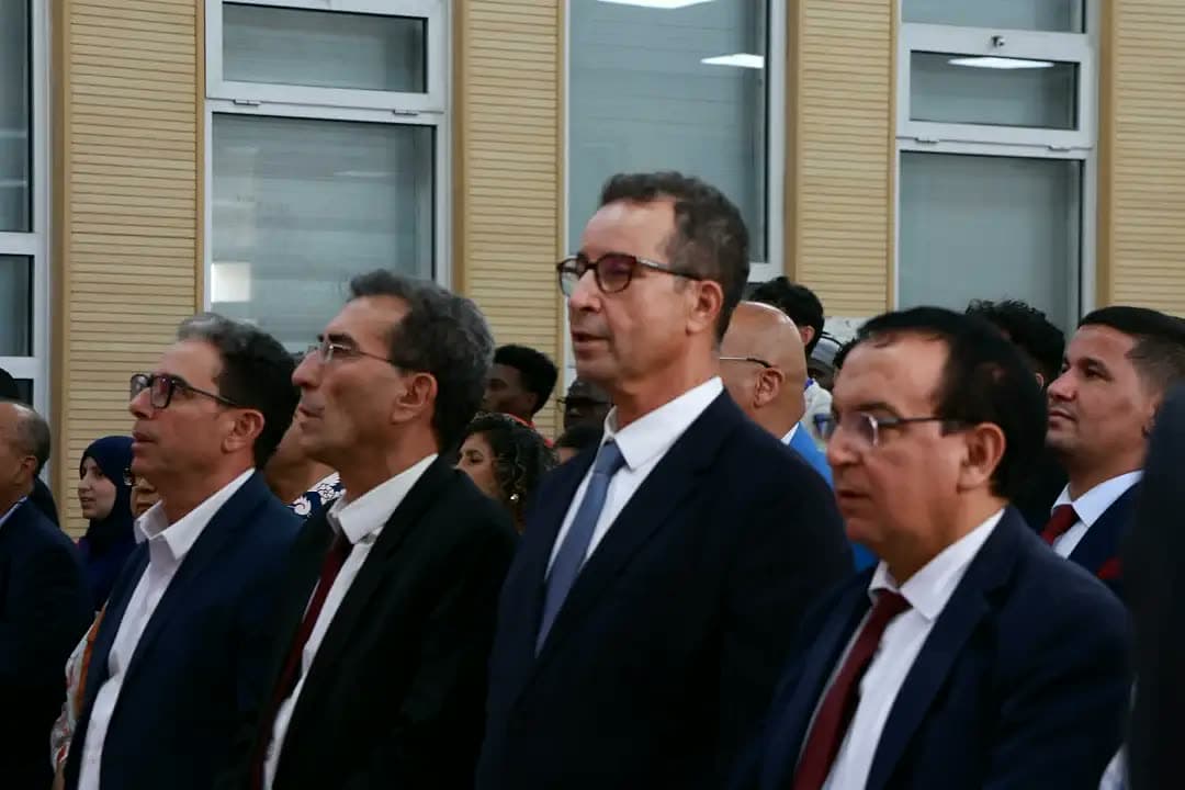 Professors and directors of the university's schools standing in the front row.