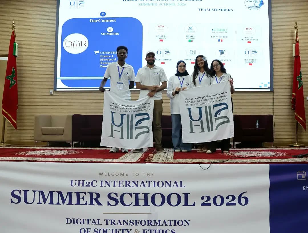 Team DarConnect with their banners on stage.