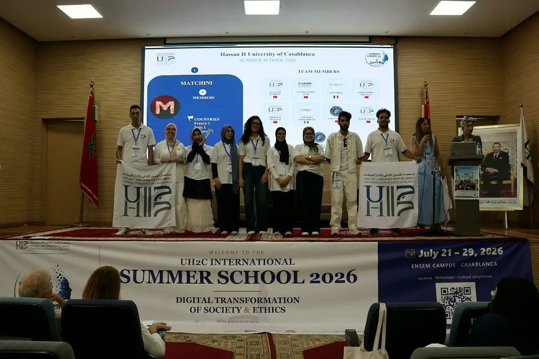 Team Matchini on stage with their members slide.