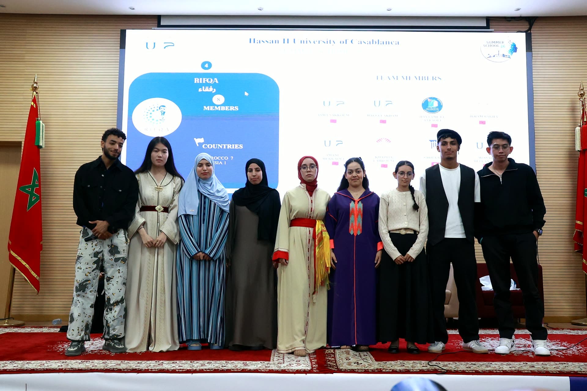 Team Rifqa on stage in Moroccan traditional dress.