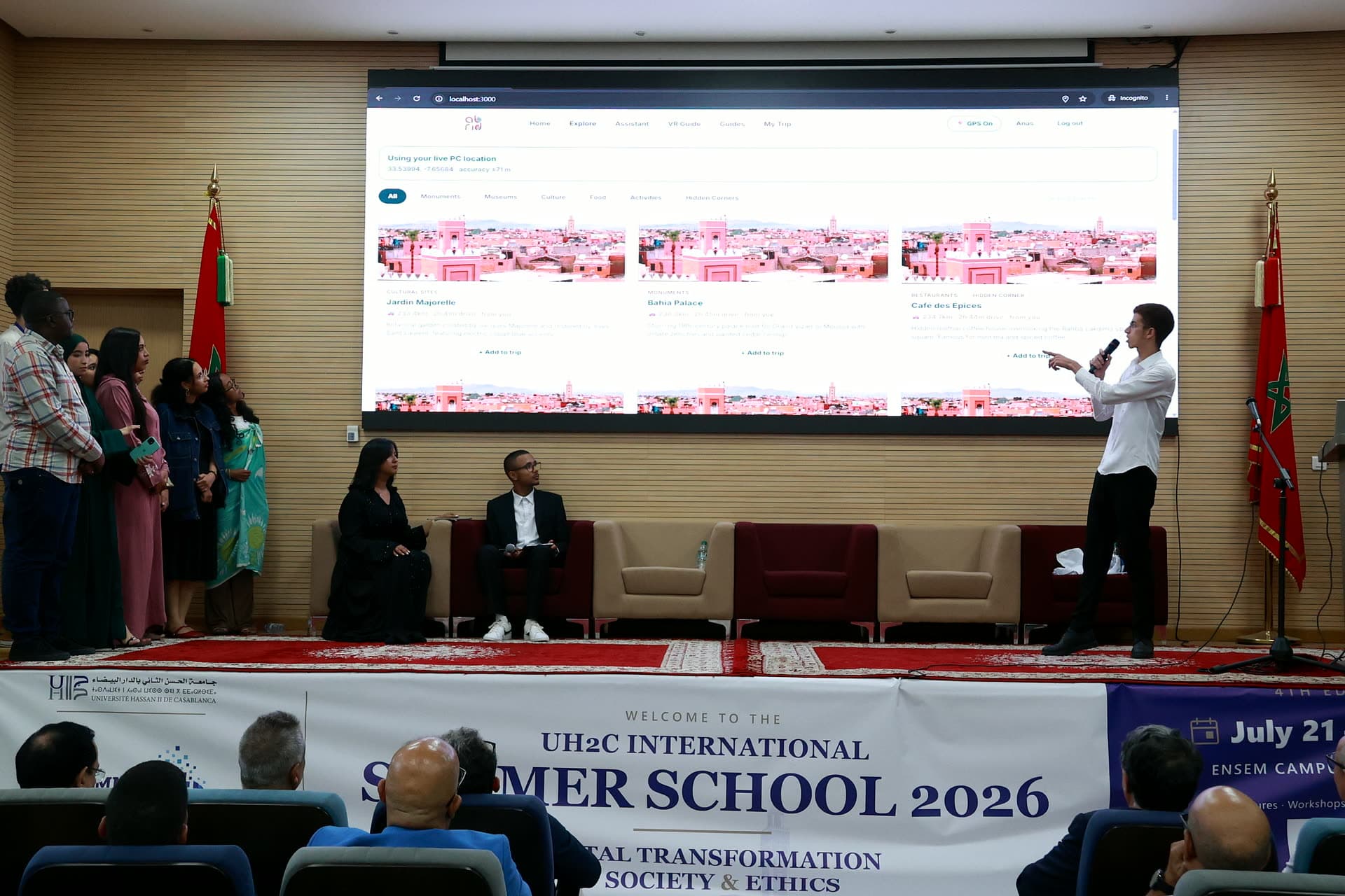 Participant demoing the team's live website on the big screen.